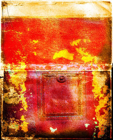 Peeling wall with dents, cracks and patches of colourの写真素材