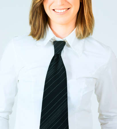 Young business  woman in crisp white shirt and black tieの写真素材