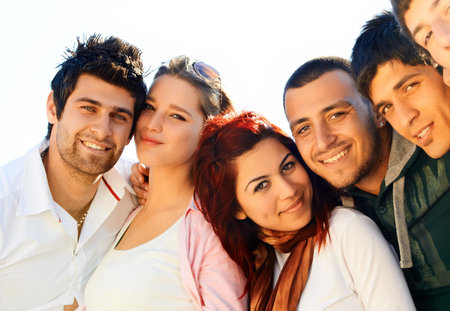 young Turkish student group of friends in a row with faces closeの写真素材