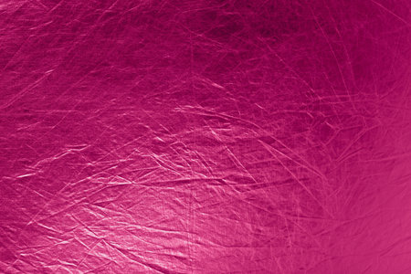 metallic textured bright pink background with empty spaceの写真素材