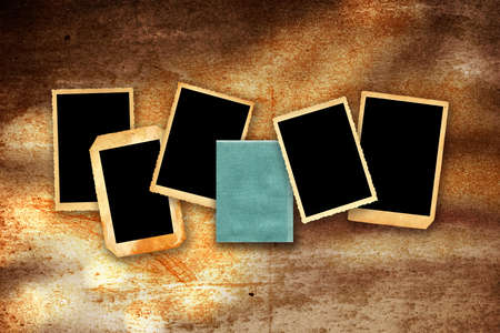 old photographic borders with stains and space for text or picture on grunge wall backgroundの写真素材