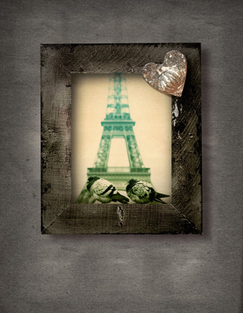 wooden grunge frame with two doves on the background of Eiffel Tower in Paris and a rustic heart.の写真素材