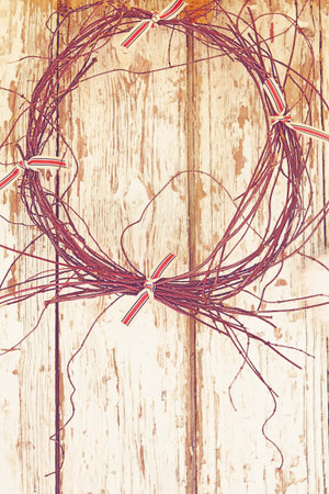 twigs wreath on a grunge wooden farm barn door with copy space  