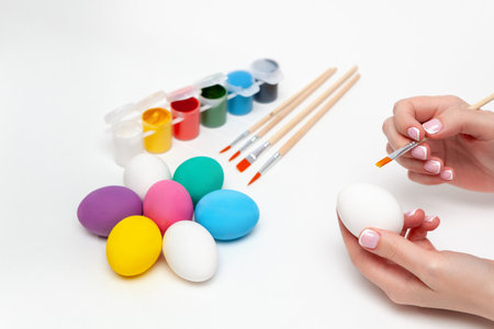 Happy Easter. painting eggs. Paints, felt-tip pens, decorations for coloring eggs for holiday. creative background. Family with kids preparing for Easterの写真素材