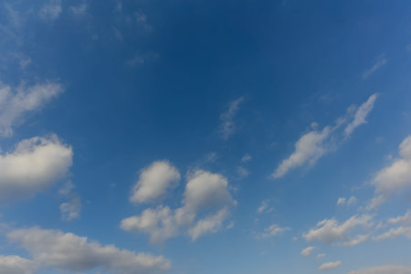 A huge, endless sky, illuminated by the rising sun, pink, blue, white fluffy clouds in summer time