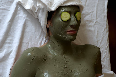 Hispanic  female lying on Spa tableの写真素材