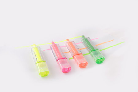 four different color Highlighting Pens paralelled together