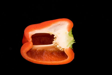 Beautiful dissected pimiento on black background, studio styleの写真素材