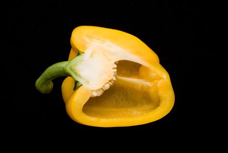 Beautiful dissected pimiento on black background, studio styleの写真素材