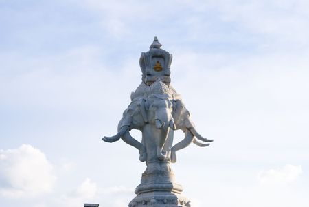 elephant monument in bangkok street against blue skyの写真素材