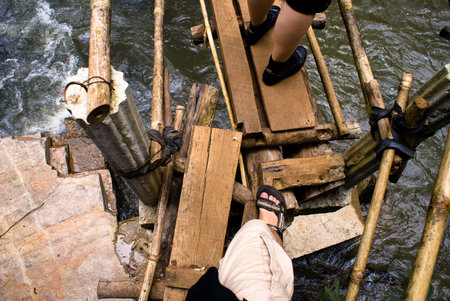 people adventure trekking in northern thailand forestの写真素材