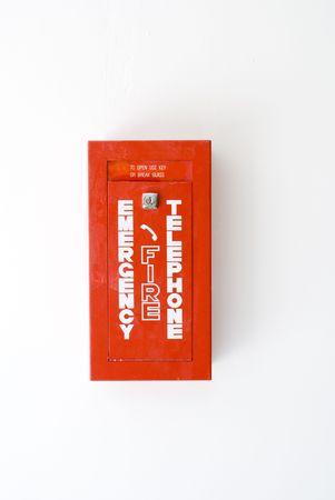 red fire box isolated on white wallの写真素材