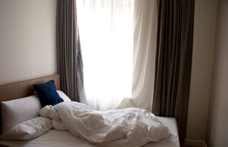 Comfortable bed in modern hotel in the morning