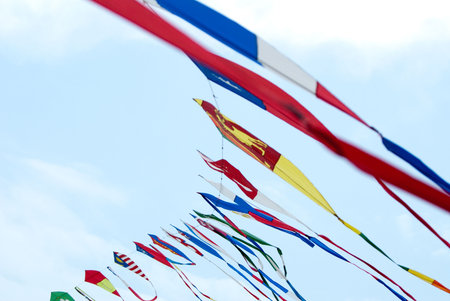 Waving asian countries national flag kites in action