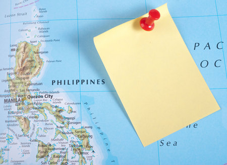 Yellow Note and red pin on map of Philippines