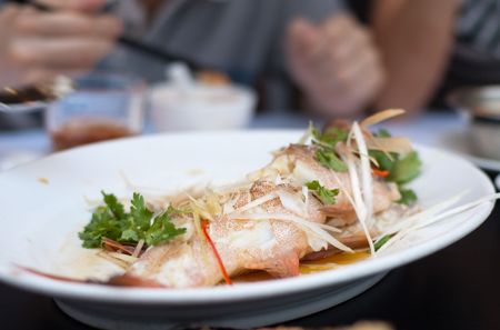 Delicious Chinese seafood dish in white plateの写真素材