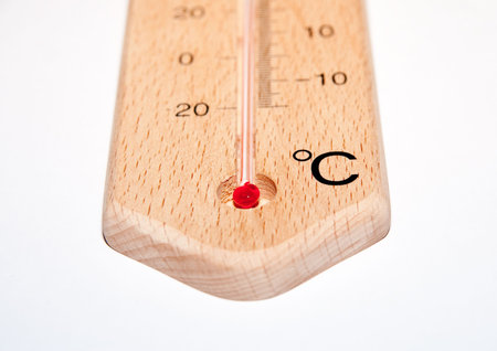 closeup of wooden thermometer with scale isolated on whiteの写真素材