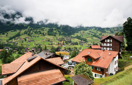 Mountainous green scenery in Switzerland village in summerの写真素材