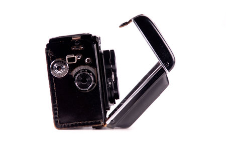 Antique medium format film mechanical camera isolated on white
