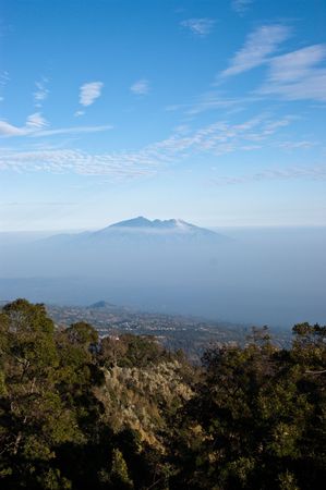 Mountain Summit background within blue color mistの写真素材