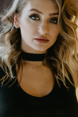 blonde girl in leather clothes