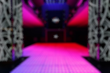 Bokeh background color disco. Blurred background nightclub spotlight on disco. Disco lights in the shape of a star. Blur background in the form of starsの写真素材