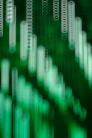 Green bokeh light background. Disco lights in the shape of a circle. Blur background in the form of a circleの写真素材