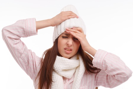 Young woman fell ill and holding his head. Sick Woman, flu. Headache. Virus. Medicinesの写真素材