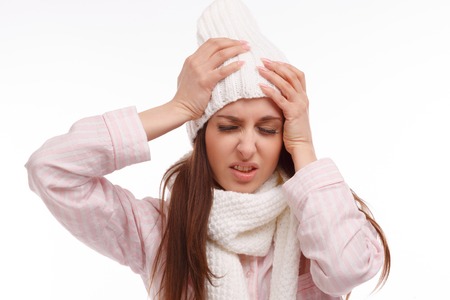 Young woman fell ill and holding his head. Sick Woman, flu. Headache. Virus .Medicinesの写真素材