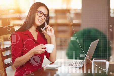 Young business woman in glasses and red shirt talking on a mobile phone. Business infographicの写真素材