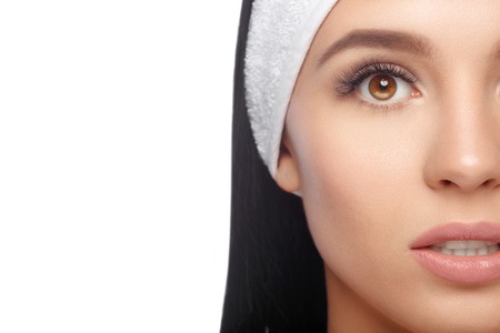 Closeup Woman in Hairband, her Face with a Perfectly Clean Skin. Happy Woman after Bath with Clean Perfect Skin. Skin Care, Cosmetics and Makeup Concept.の写真素材