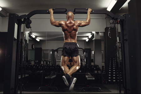 Mature sportsman exercising at the gymの写真素材