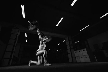 Female fitness athlete exercisingの写真素材