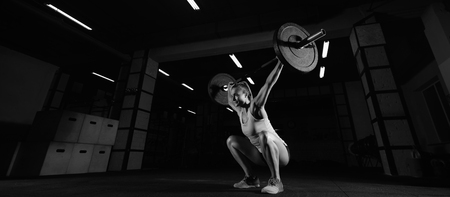 Female fitness athlete exercisingの写真素材