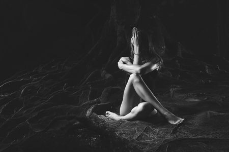 Young woman practicing yoga outdoorsの写真素材