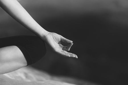 Young woman practicing yoga outdoorsの写真素材