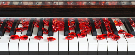 Keys to my heart. Red hearts on a piano keyboard.の写真素材