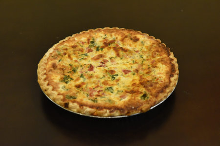 Freshly baked quiche with ham and cheese