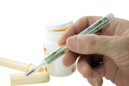 thermometer for measure body temperature in the hand on a white background