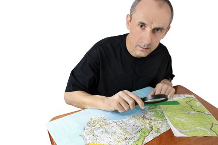 middle-aged man  is studying the map and preparing for a tourの写真素材