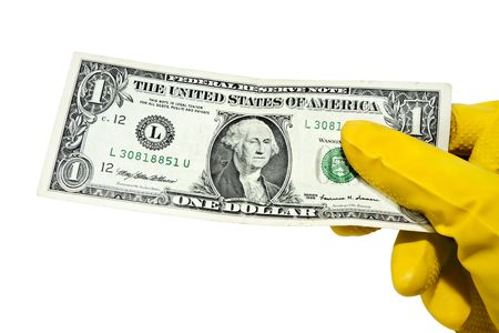 one-dollar bill in his hand in a glove on a white backgroundの写真素材