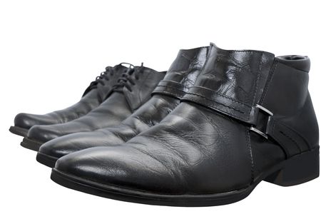 black boots isolated on a white background with focusing on near-toe shoesの写真素材
