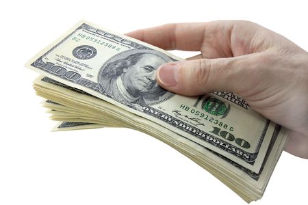 hundred dollar bills in hand isolated on white backgroundの写真素材