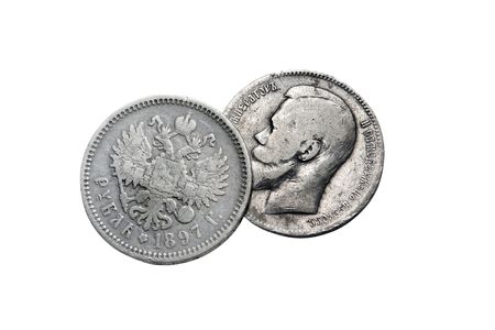 two ancient silver coins isolated on a black backgroundの写真素材