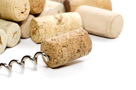 corks with corkscrew on a white backgroundの写真素材