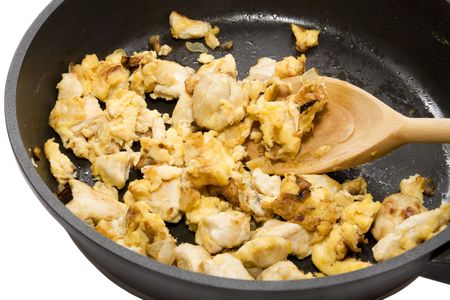 fried meat with an egg in a panの写真素材