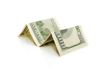 one hundred dollar bill curved into four partsの写真素材