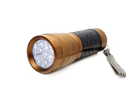 golden  flashlight isolated on a white backgroundの写真素材