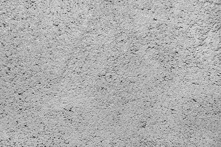 gray plaster wall backgroundの写真素材