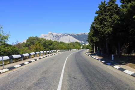 turn paved road in the mountainsの写真素材